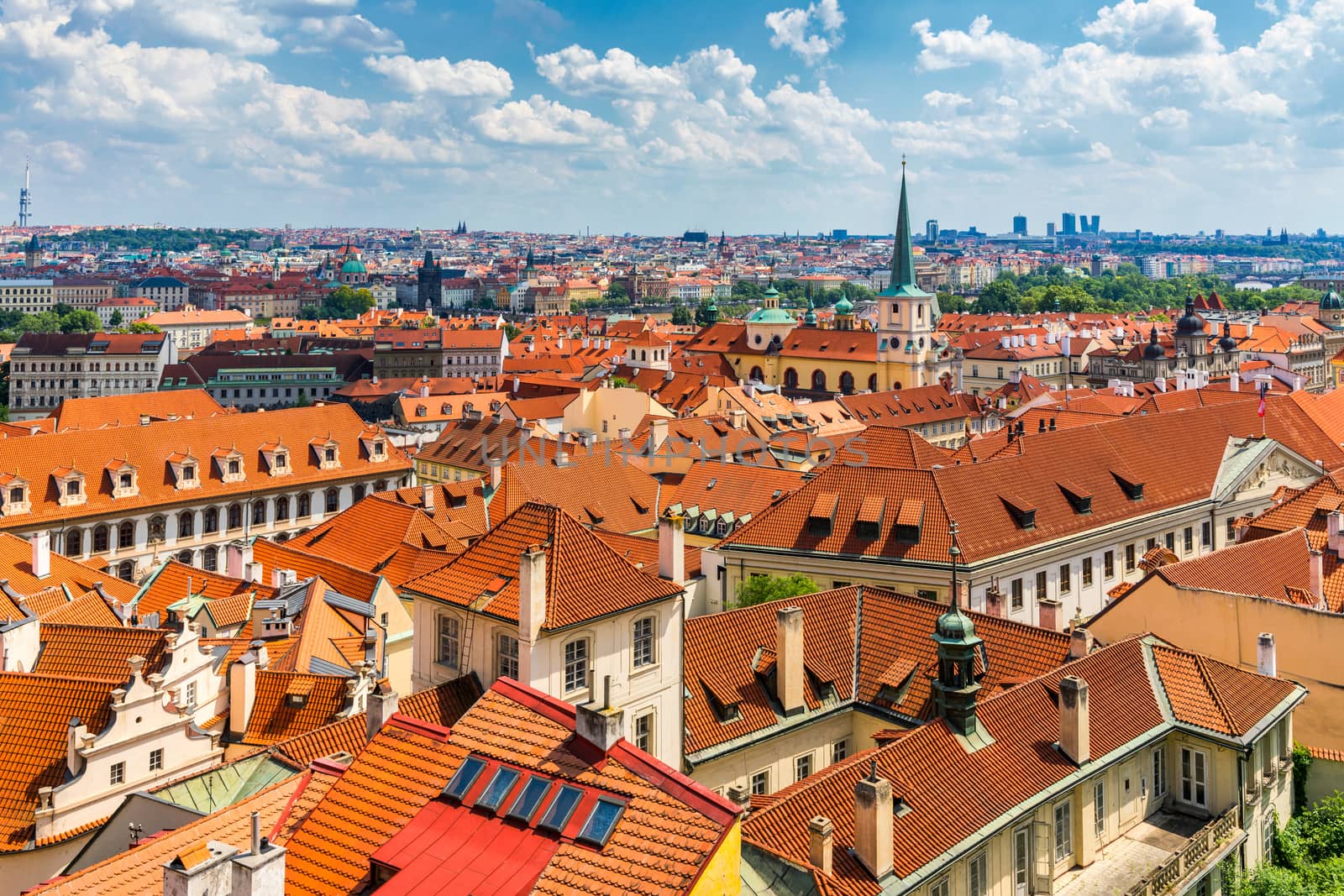 Old town of Prague. Czech Republic over river Vltava with Charles Bridge on skyline. Prague panorama landscape view with red roofs.  Prague view from Petrin Hill, Prague, Czechia.