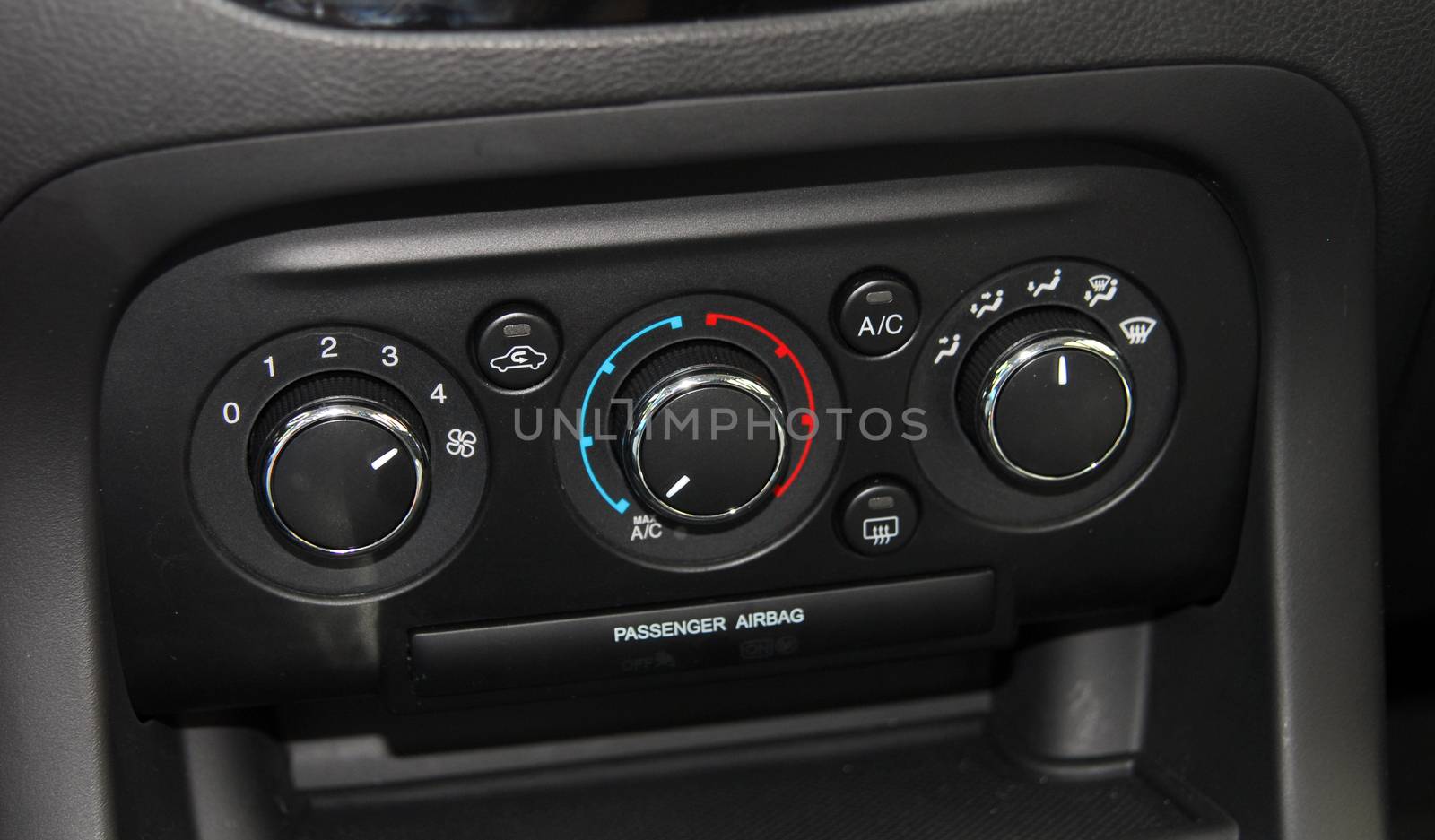 manual switches the air conditioning on the dashboard of the car
