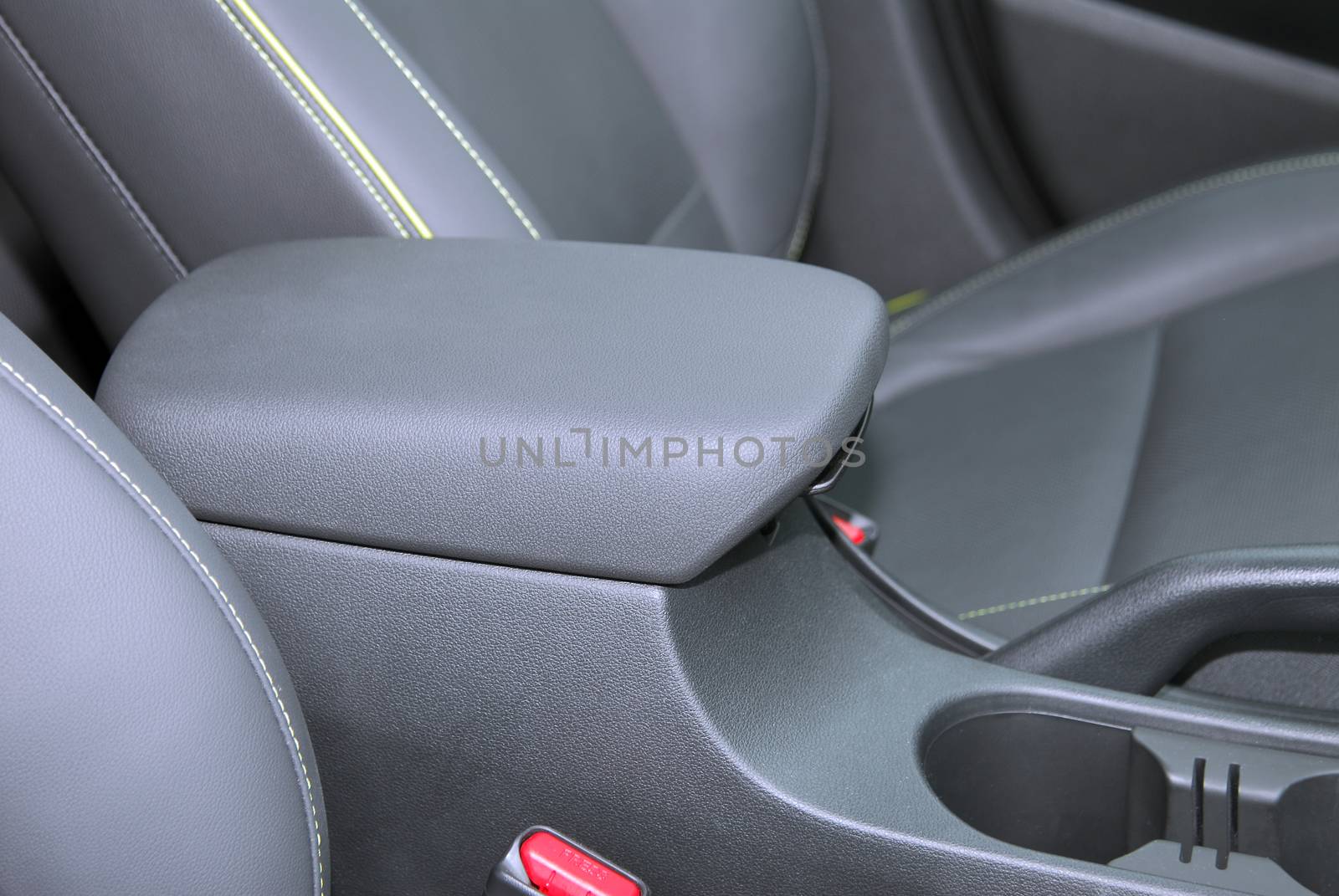 armrest in the luxury passenger car between the front seats by aselsa