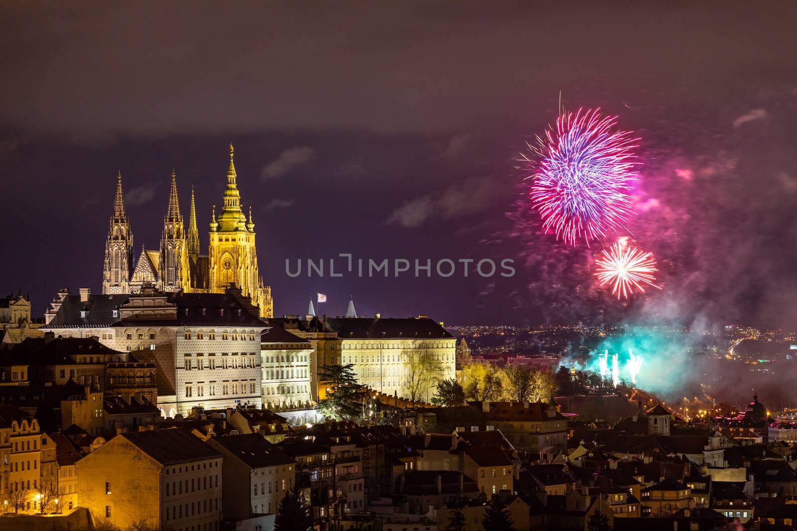 Fireworks over the Old Town of Prague, Czech Republic. New Year fireworks in Prague, Czechia. Prague fireworks during New Year Celebration near St. Vitus Cathedral, Prague, Czech republic.