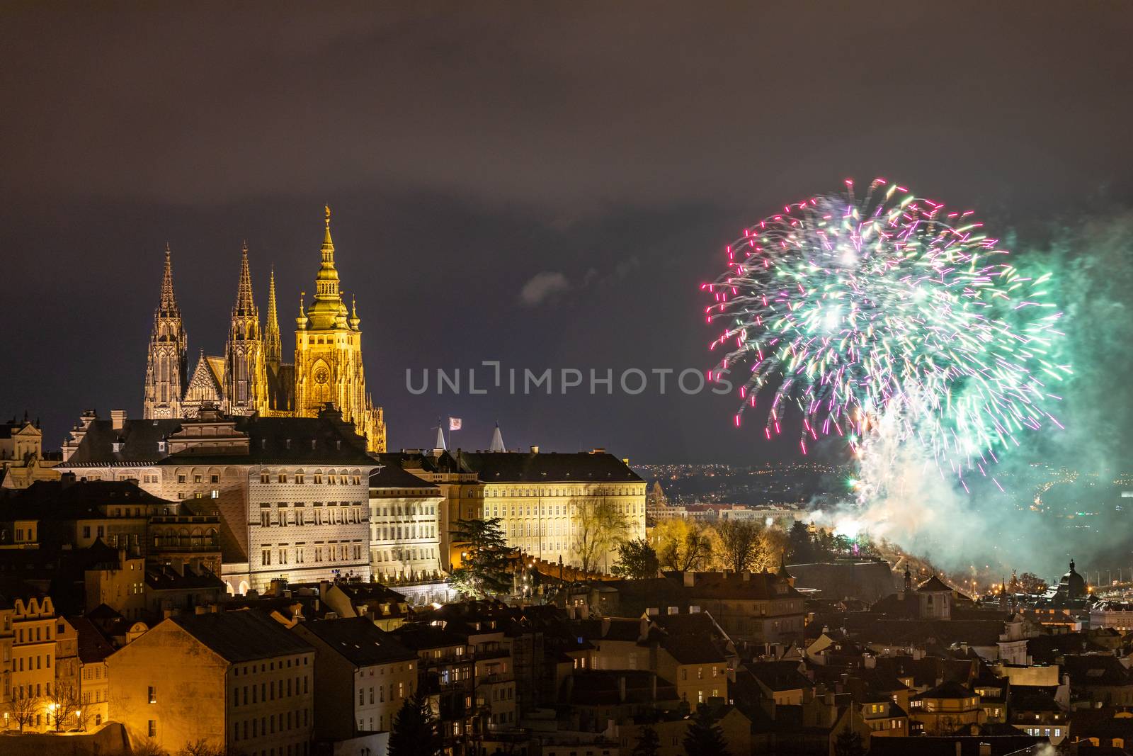 Fireworks over the Old Town of Prague, Czech Republic. New Year fireworks in Prague, Czechia. Prague fireworks during New Year Celebration near St. Vitus Cathedral, Prague, Czech republic.