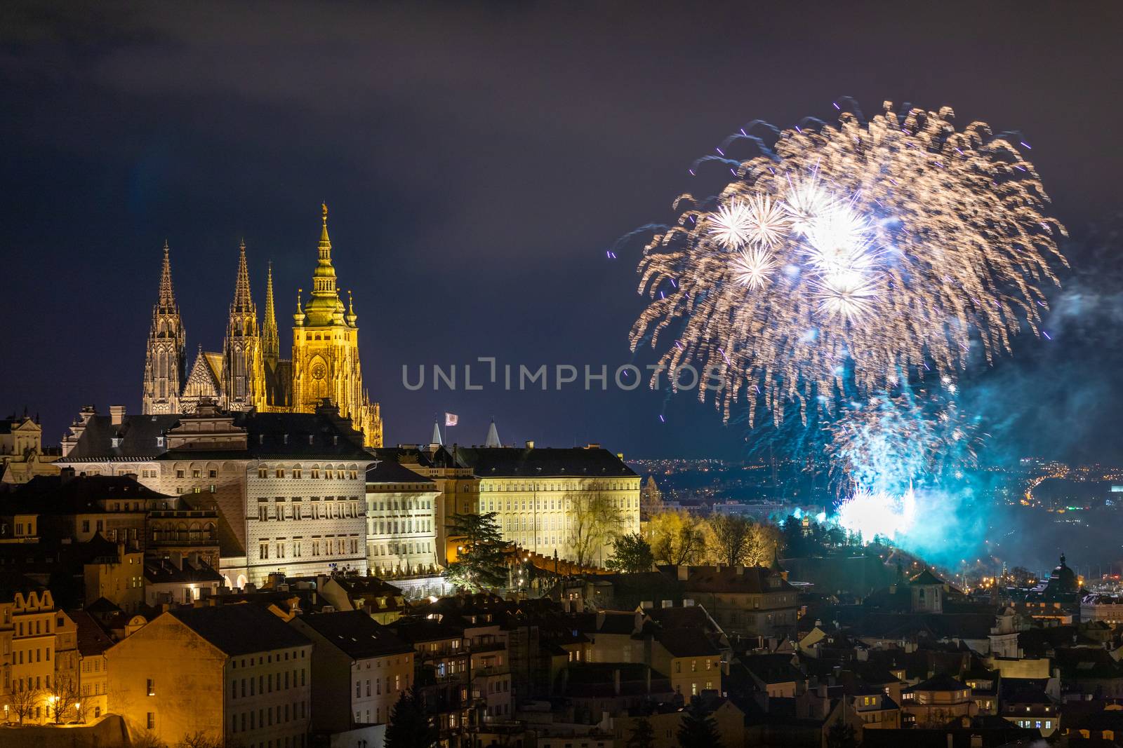 Fireworks over the Old Town of Prague, Czech Republic. New Year fireworks in Prague, Czechia. Prague fireworks during New Year Celebration near St. Vitus Cathedral, Prague, Czech republic.