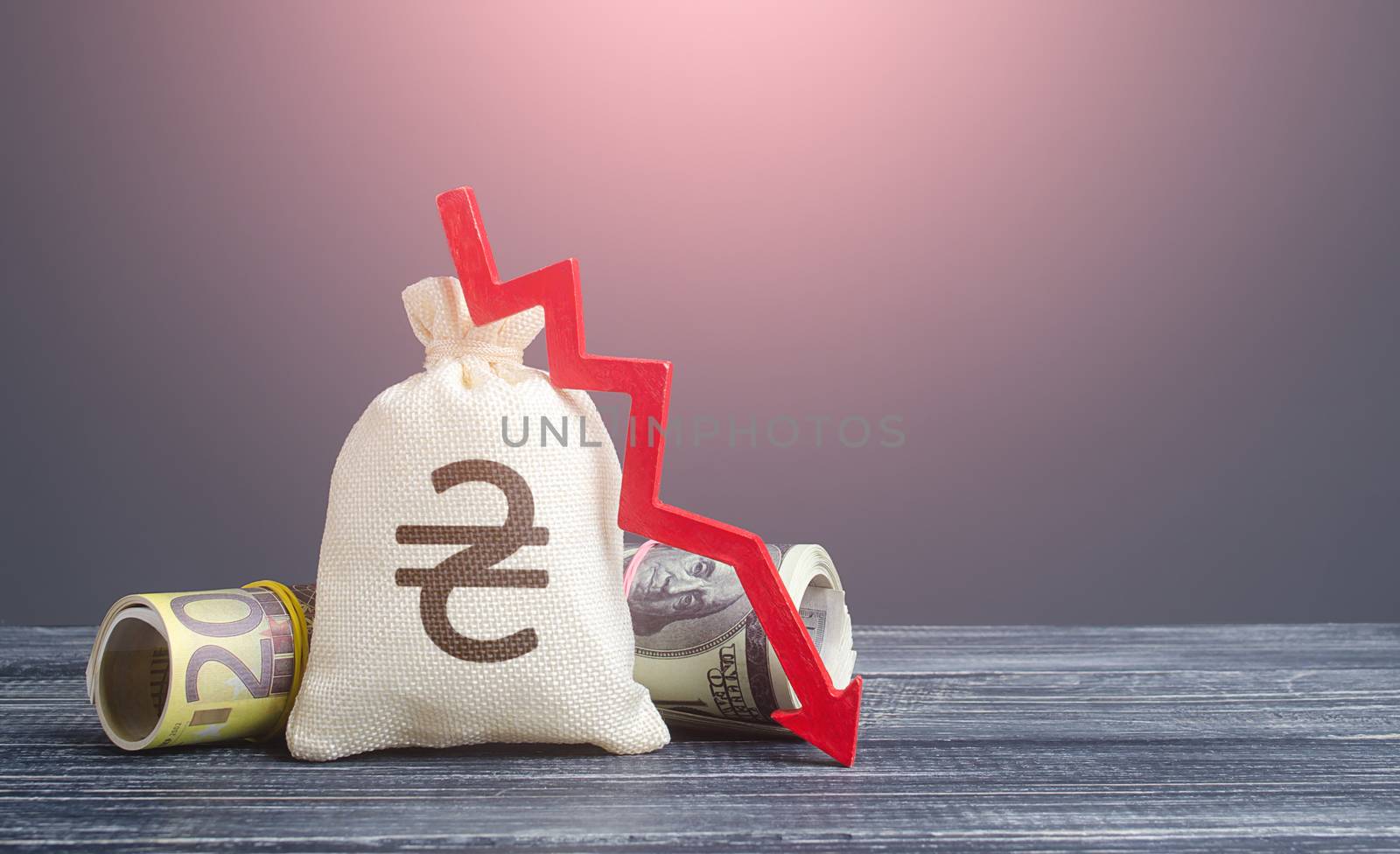 Ukrainian hryvnia money bag and red arrow down. Economic difficulties. Stagnation, recession, declining business activity, falling wealth. Crisis, loss savings. Devaluation and effects of quarantine