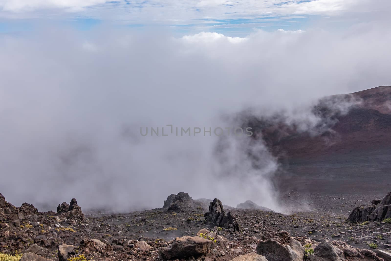 Fog lingers in crater of Haleakala Volcano, Maui, Hawaii, USA. by Claudine