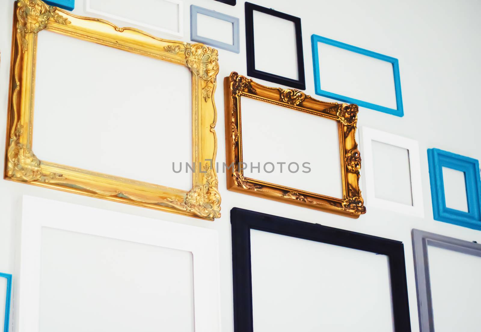 Empty art frames on gallery wall, decor and design by Anneleven