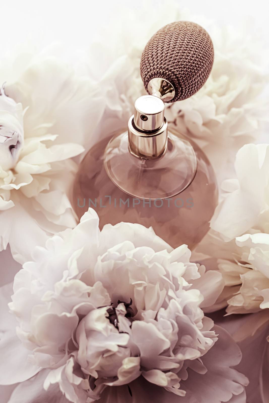 Retro fragrance bottle as luxury perfume product on background of peony flowers, parfum ad and beauty branding by Anneleven