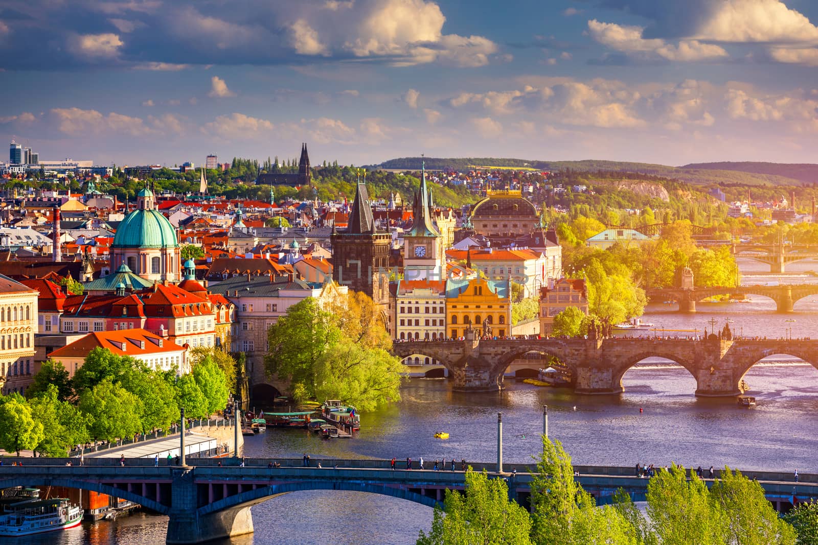 Scenic view of the Old Town pier architecture and Charles Bridge over Vltava river in Prague, Czech Republic. Prague iconic Charles Bridge (Karluv Most) and Old Town Bridge Tower at sunset, Czechia.