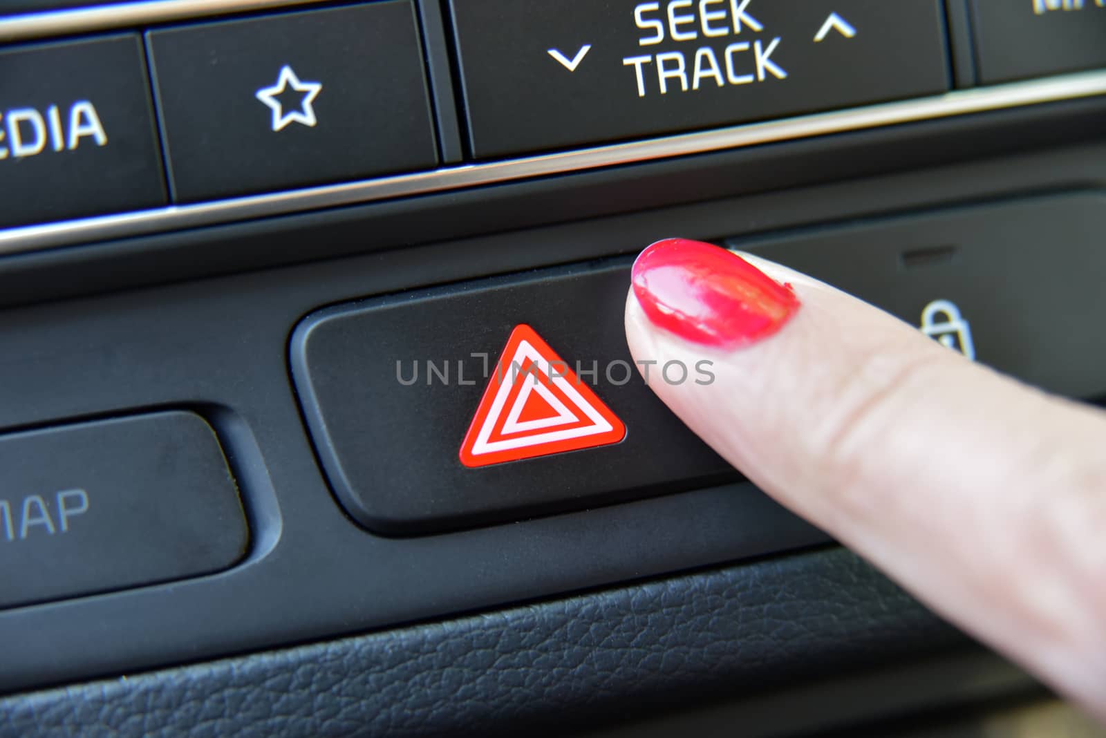 woman pressing red triangle car hazard warning button by aselsa
