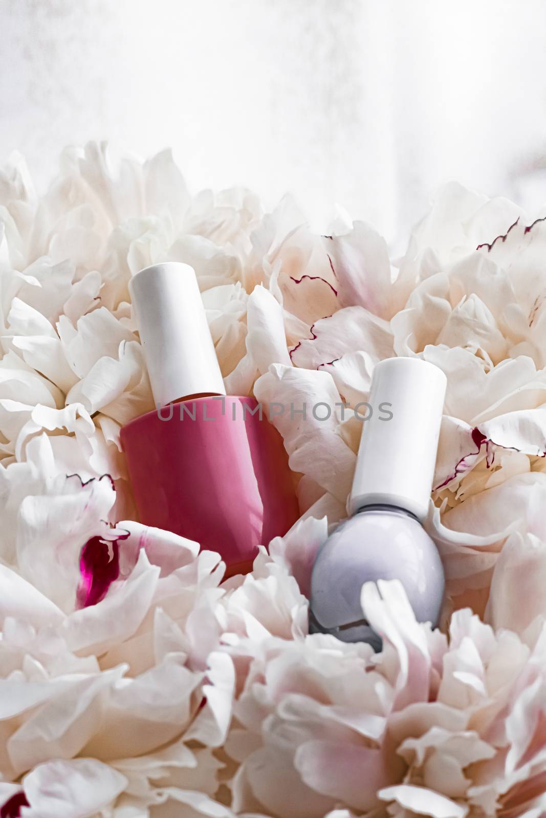 Nail polish bottles on floral background, french manicure and cosmetic branding by Anneleven