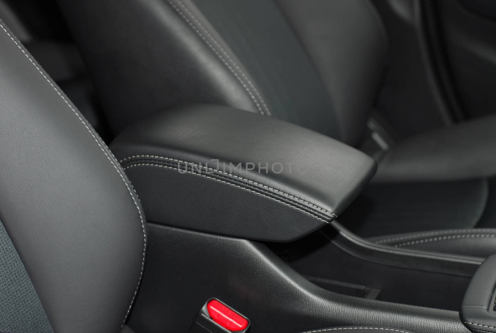 armrest in the luxury passenger car between the front seats by aselsa