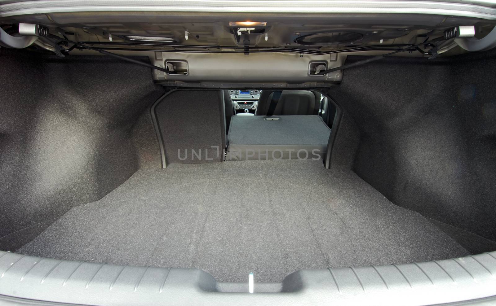 car trunk with rear seats folded of the sedan