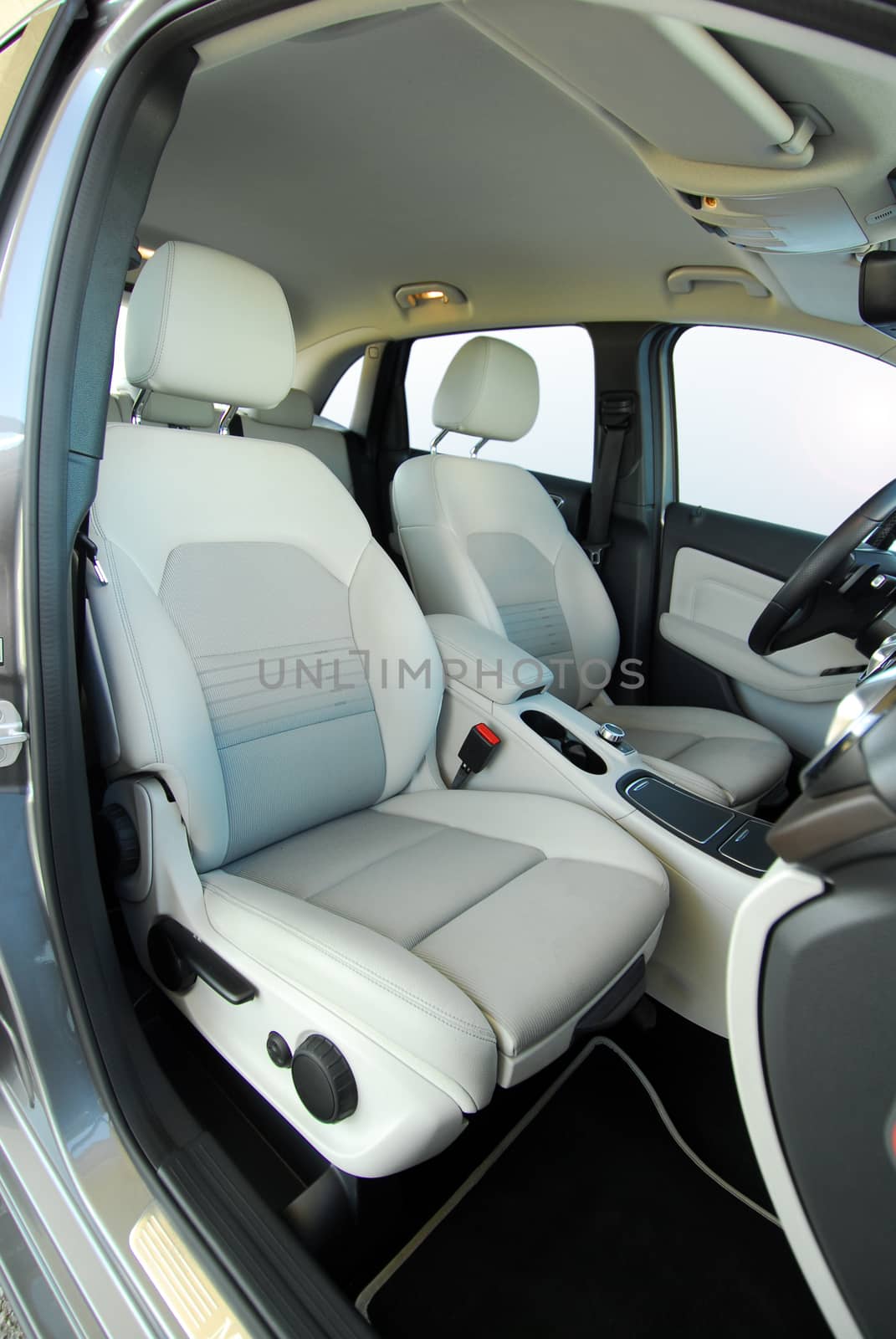 White front seats in a large passenger car