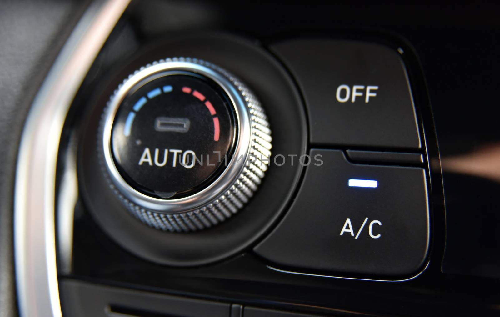 button for activating the air conditioners on the dashboard passenger car