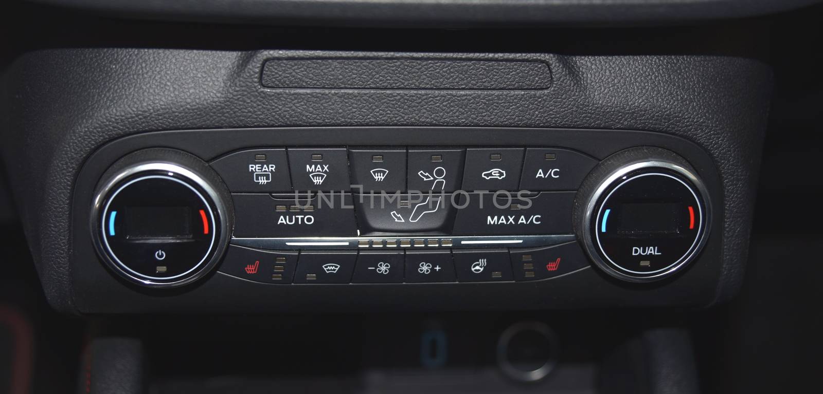 buttons for activating the air conditioners on the dashboard passenger car