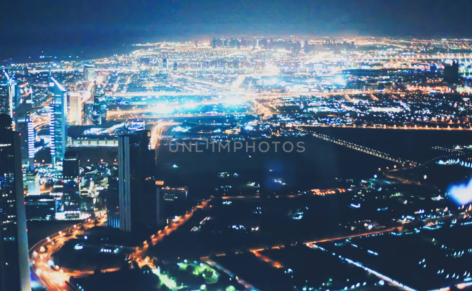 Aerial night view of Dubai in United Arab Emirates, metropolitan cityscape scenery