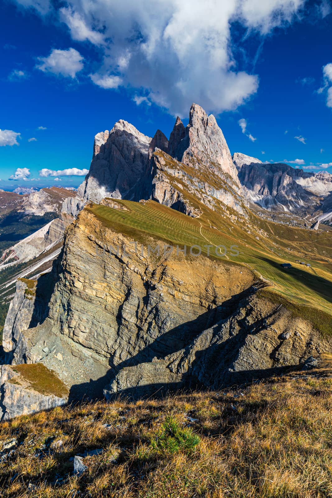 View on Seceda peak. Trentino Alto Adige, Dolomites Alps, South Tyrol, Italy. Odle mountain range, Val Gardena. Majestic Furchetta peak. Odles group seen from Seceda, Santa Cristina Val Gardena.