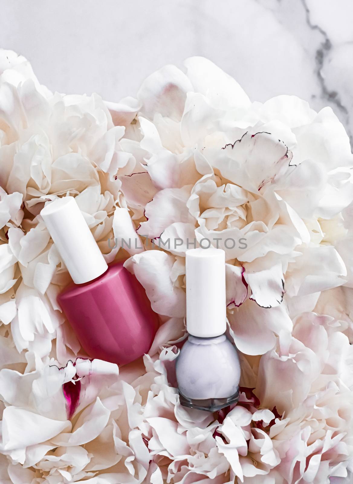 Nail polish bottles on floral background, french manicure and cosmetic branding by Anneleven