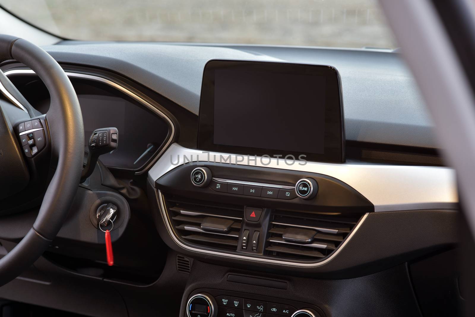Screen multimedia system on dashboard in a modern car by aselsa