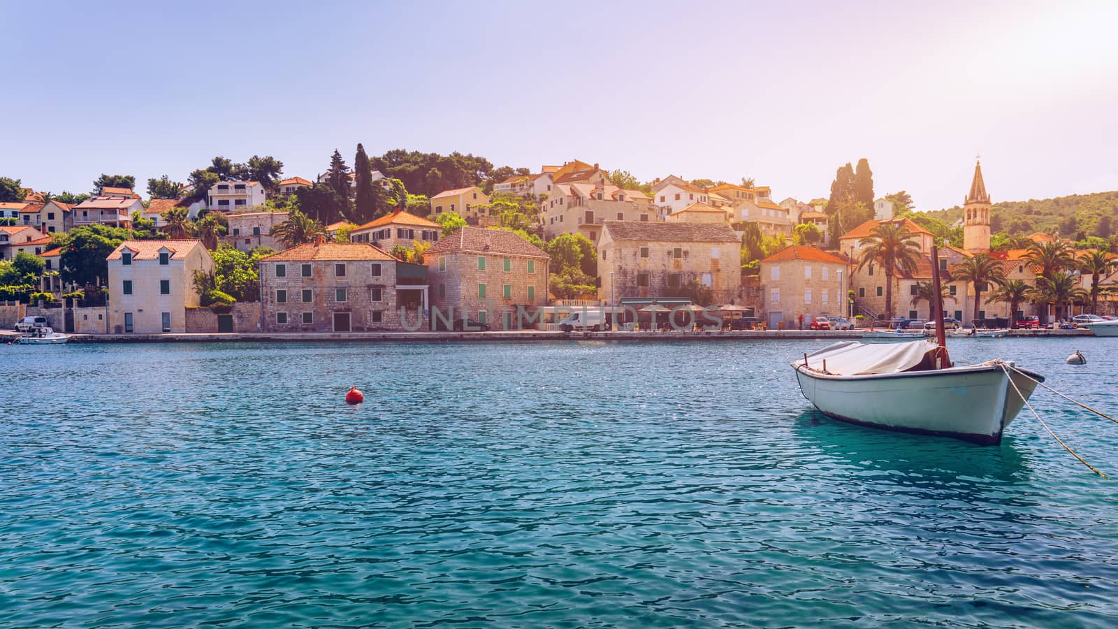 Fishing boats in Splitska village with beautiful port, Brac island, Croatia. Village of Splitska on Brac island seafront view, Dalmatia, Croatia, Croatia.