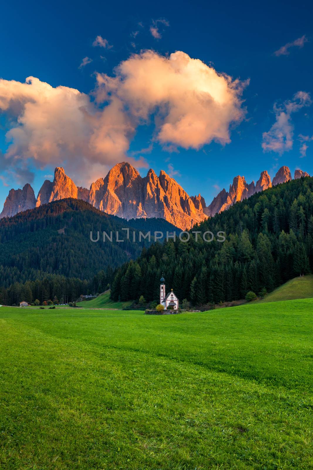 Landscapes with San Giovanni Church and small village in Val di Funes, Dolomite Alps, South Tyrol, Italy, Europe. San Giovanni in Ranui church (St John in Ranui church) in the Dolomites, Italy.