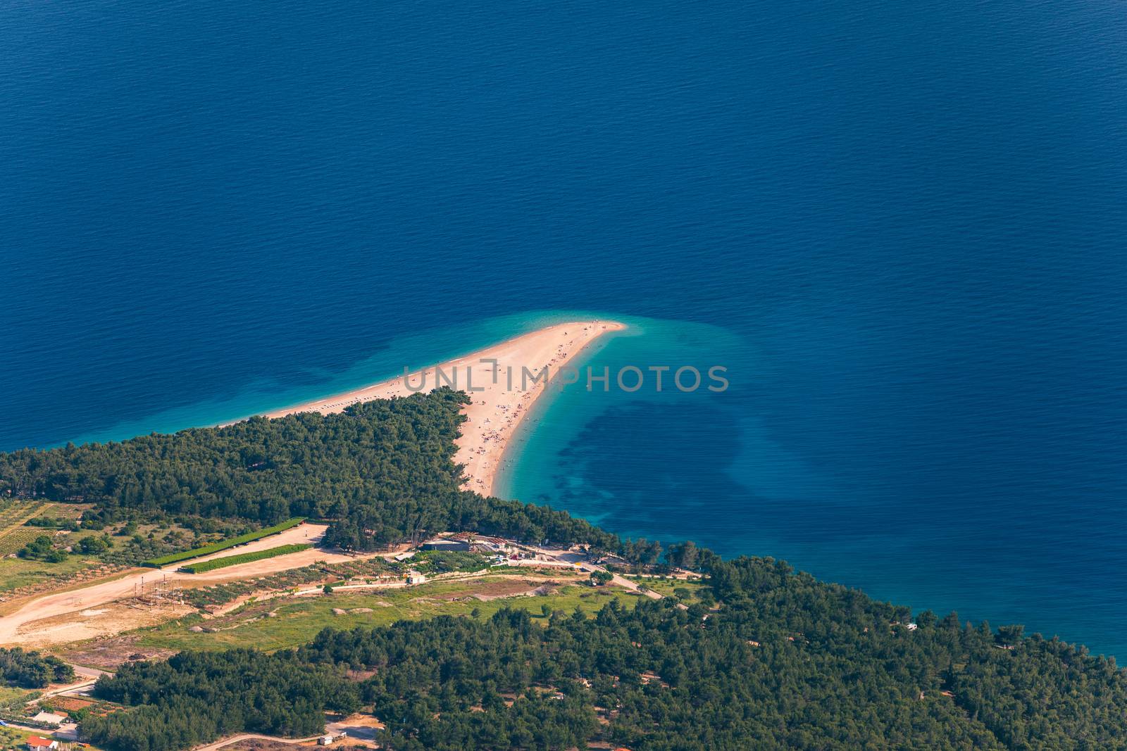 Zlatni Rat (Golden Cape or Golden Horn) famous turquoise beach in Bol town on Brac island, Dalmatia, Croatia. Zlatni Rat sandy beach at Bol on Brac island of Croatia in summertime.