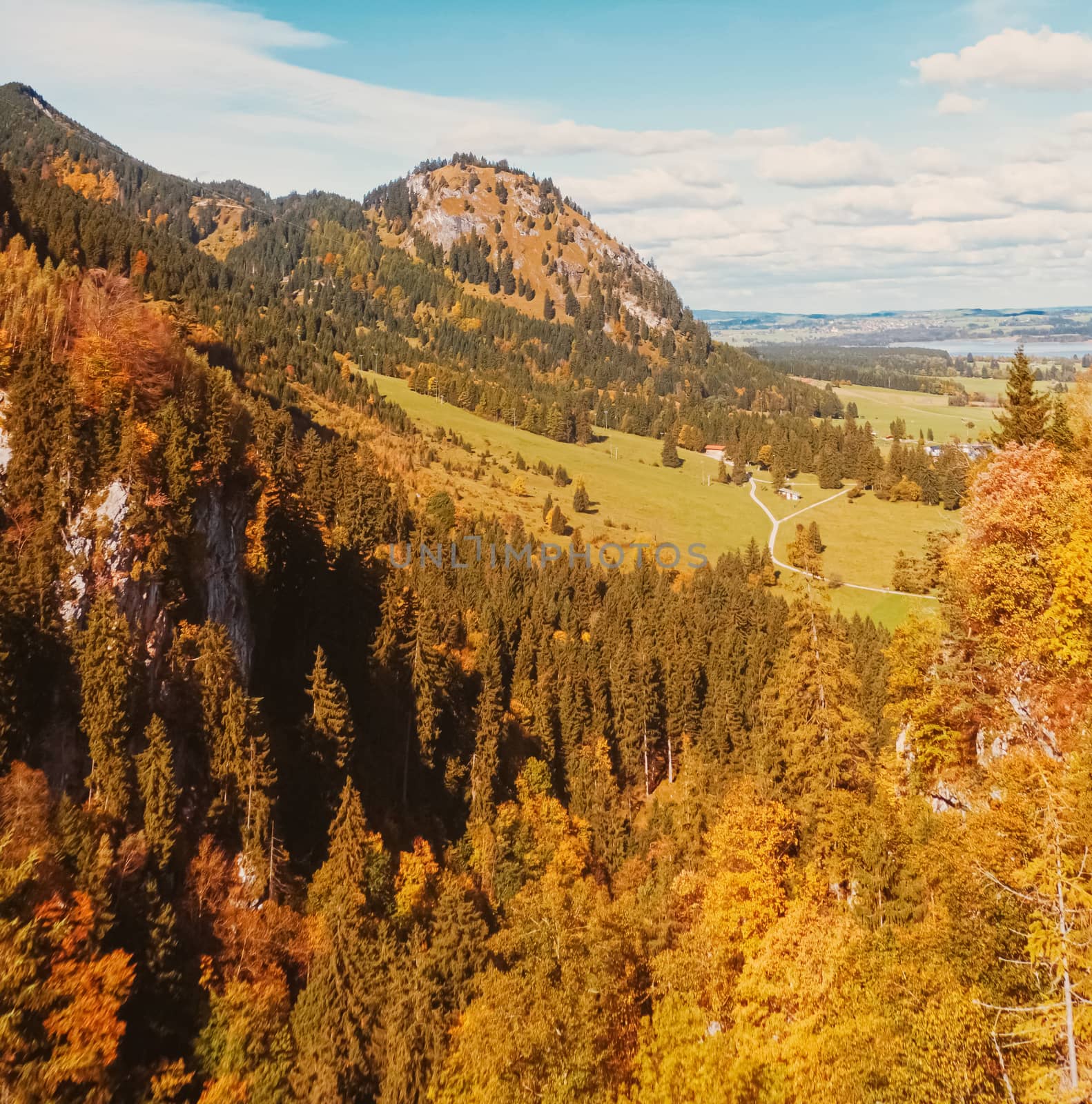 Beautiful nature of European Alps, landscape view of alpine mountains, lake and village in autumn season, travel and destination scenery