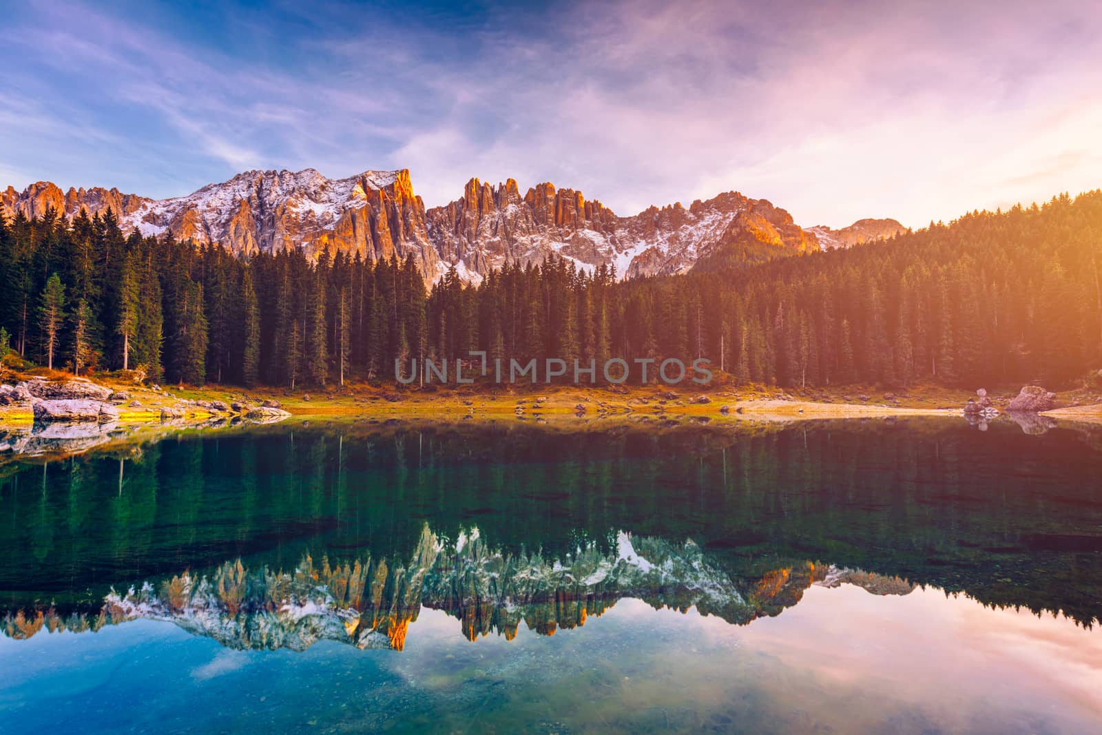 Carezza lake (Lago di Carezza, Karersee) with Mount Latemar, Bolzano province, South tyrol, Italy. Landscape of Lake Carezza or Karersee and Dolomites in background, Nova Levante, Bolzano, Italy.