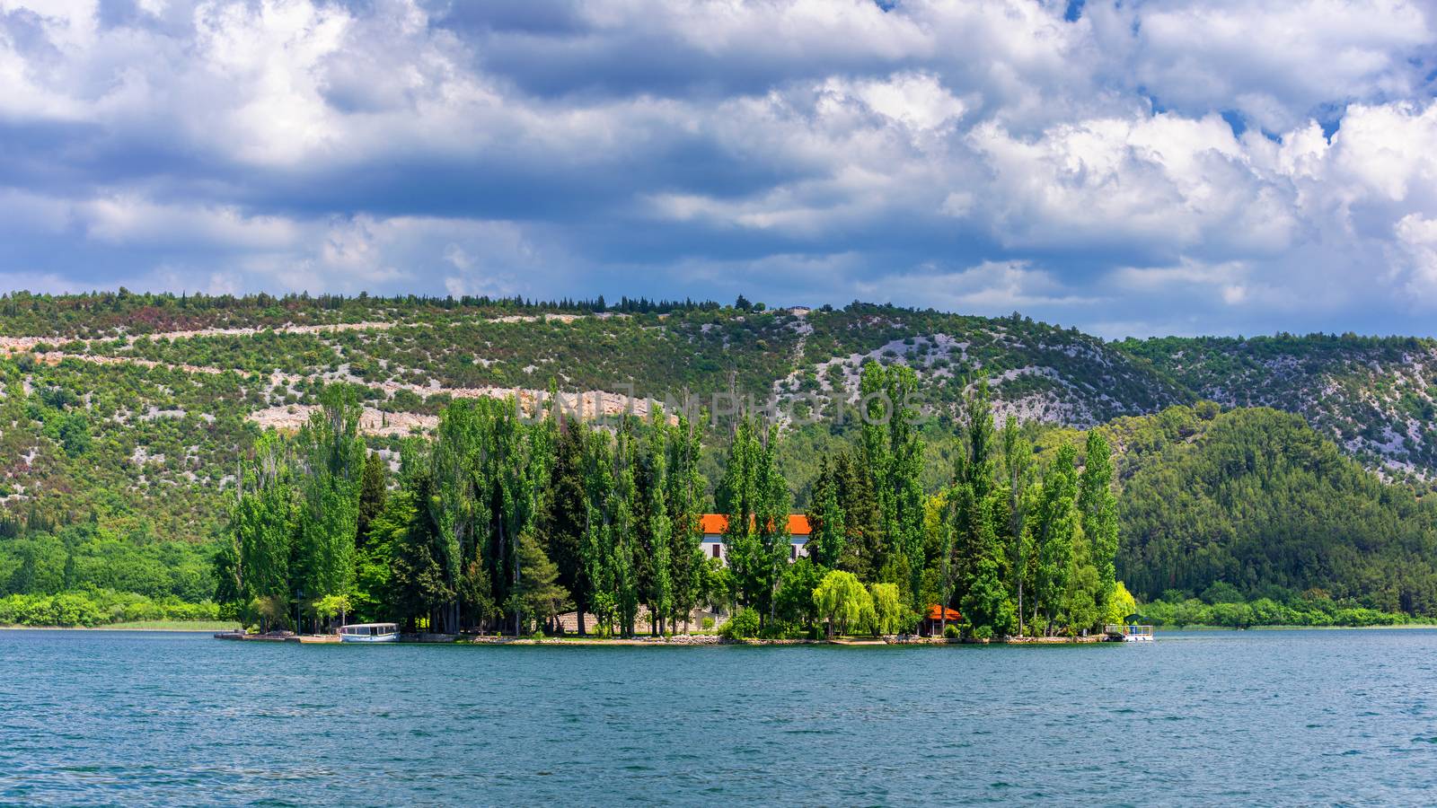 Island of Visovac monastery in Krka national park, Dalmatia, Croatia. Visovac christian monastery on the island in The Krka National park, Croatia.