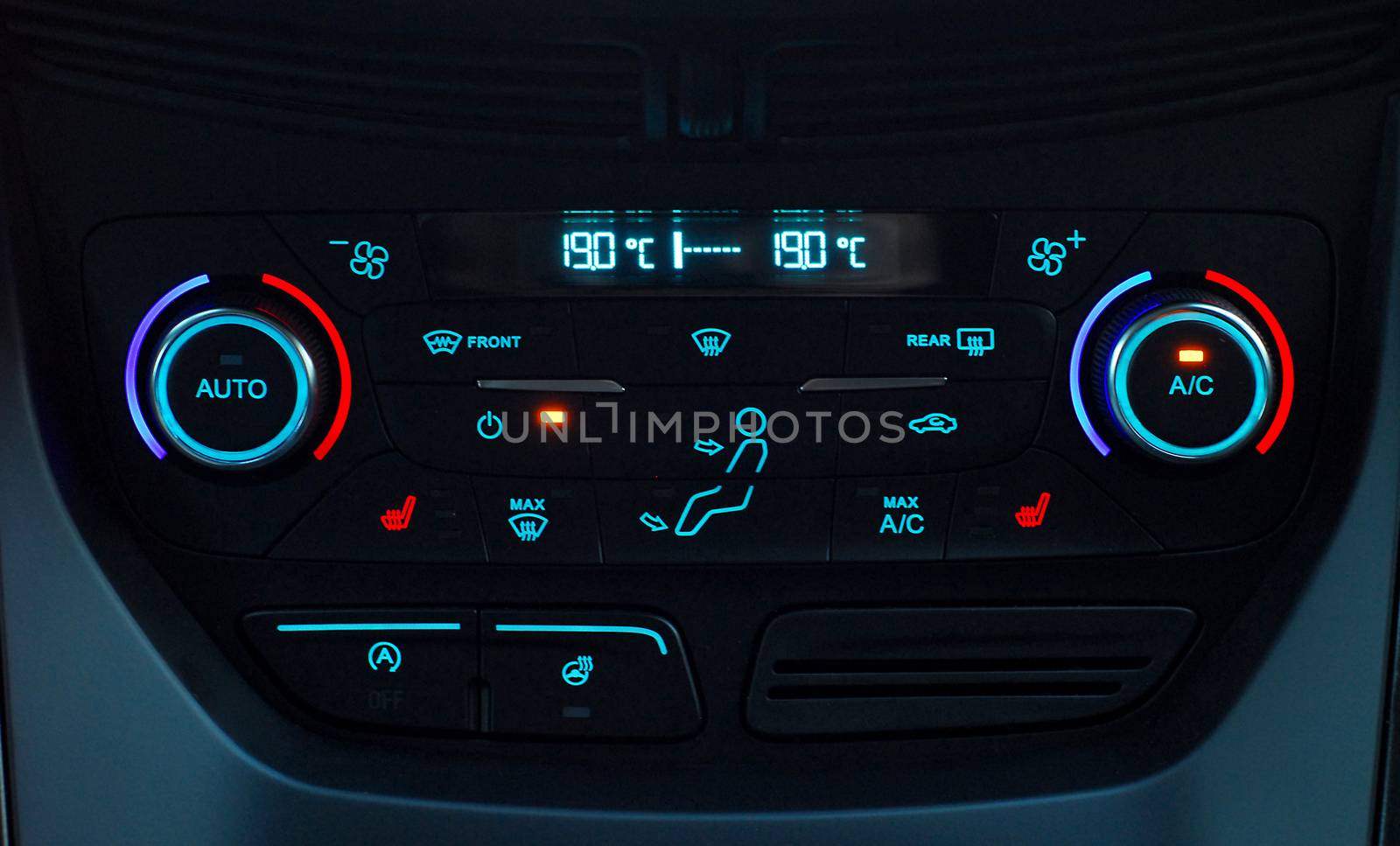 manual switches the air conditioning on the dashboard of the car