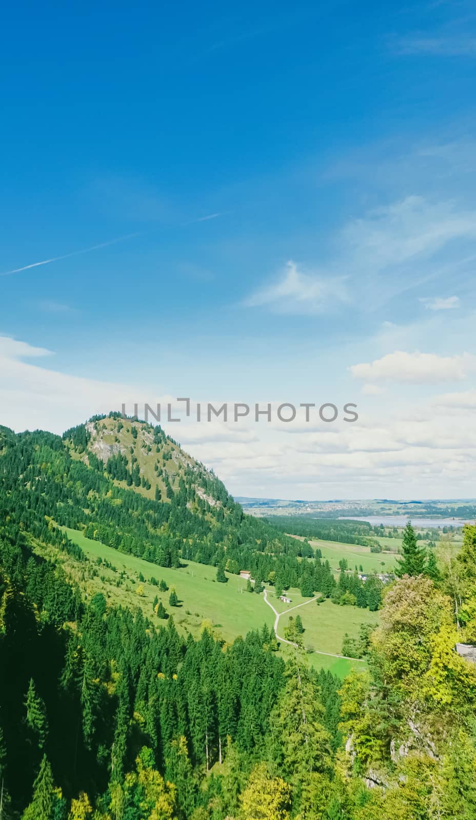 Beautiful nature of European Alps, landscape view of alpine mountains, lake and village in spring season, travel and destination scenery
