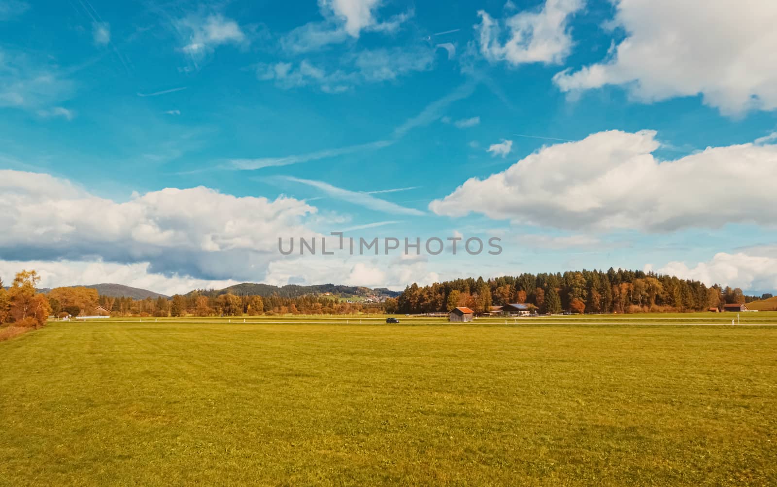 Beautiful nature of European Alps, landscape view of alpine mountains, lake and village in autumn season, travel and destination scenery