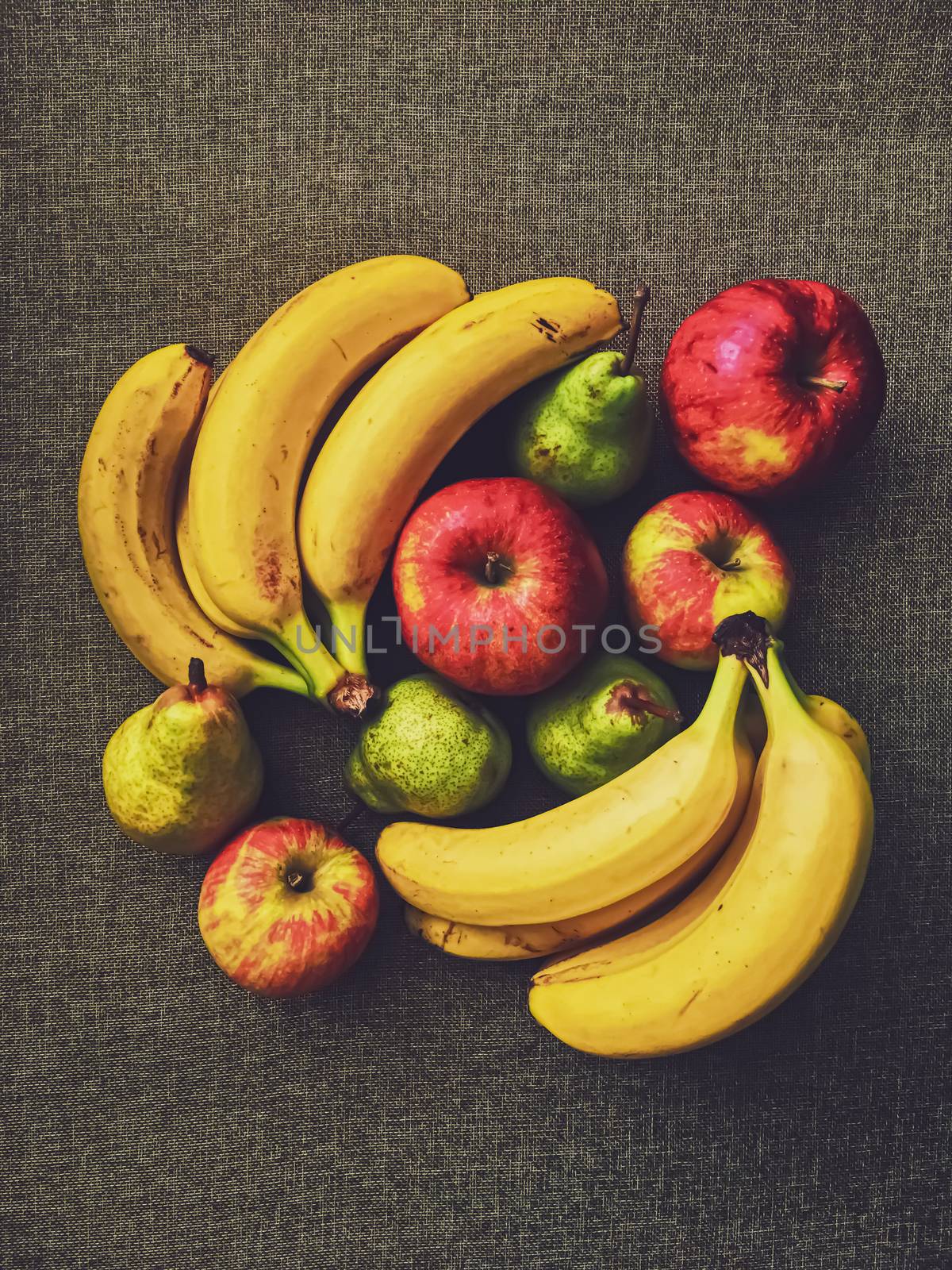 Organic apples, pears and bananas on rustic linen background, fruits farming and agriculture