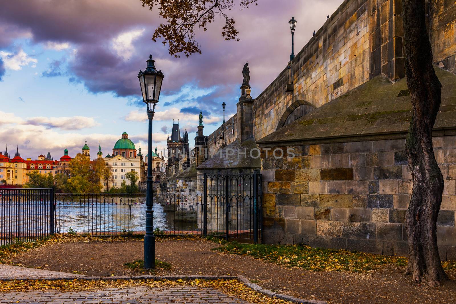 Famous Landmark, Lantern and Charles Bridge, Prague, Czech Republic. Antique lantern in the center of Prague, Charles Bridge. Cityscape of the historic center, Prague. Charles Bridge at sunset.