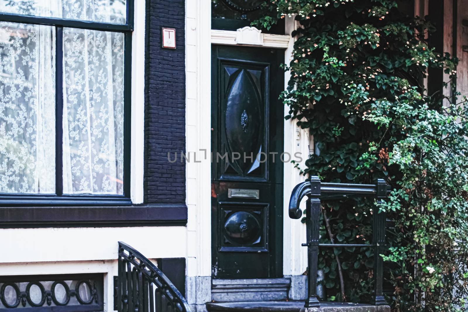 Architectural detail of a building on the main city center street of Amsterdam in Netherlands, european architecture