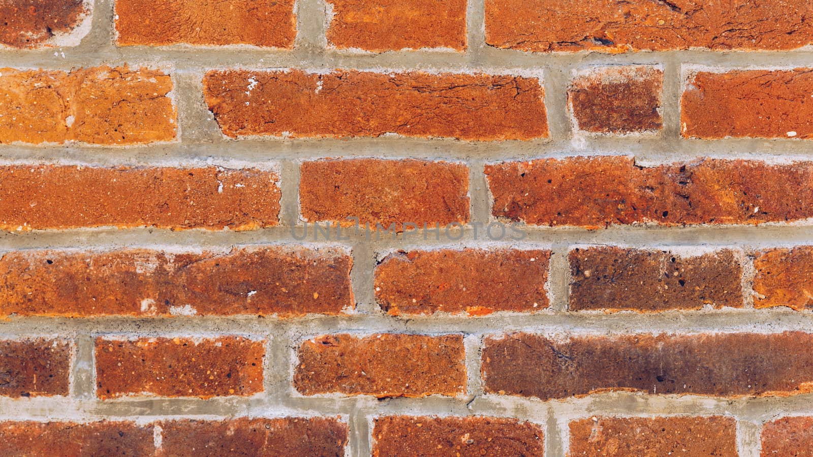 Old brick wall, old texture of red stone blocks closeup. The texture of the brick. Background of empty brick basement wall. Grunge red brick wall background with copy space.