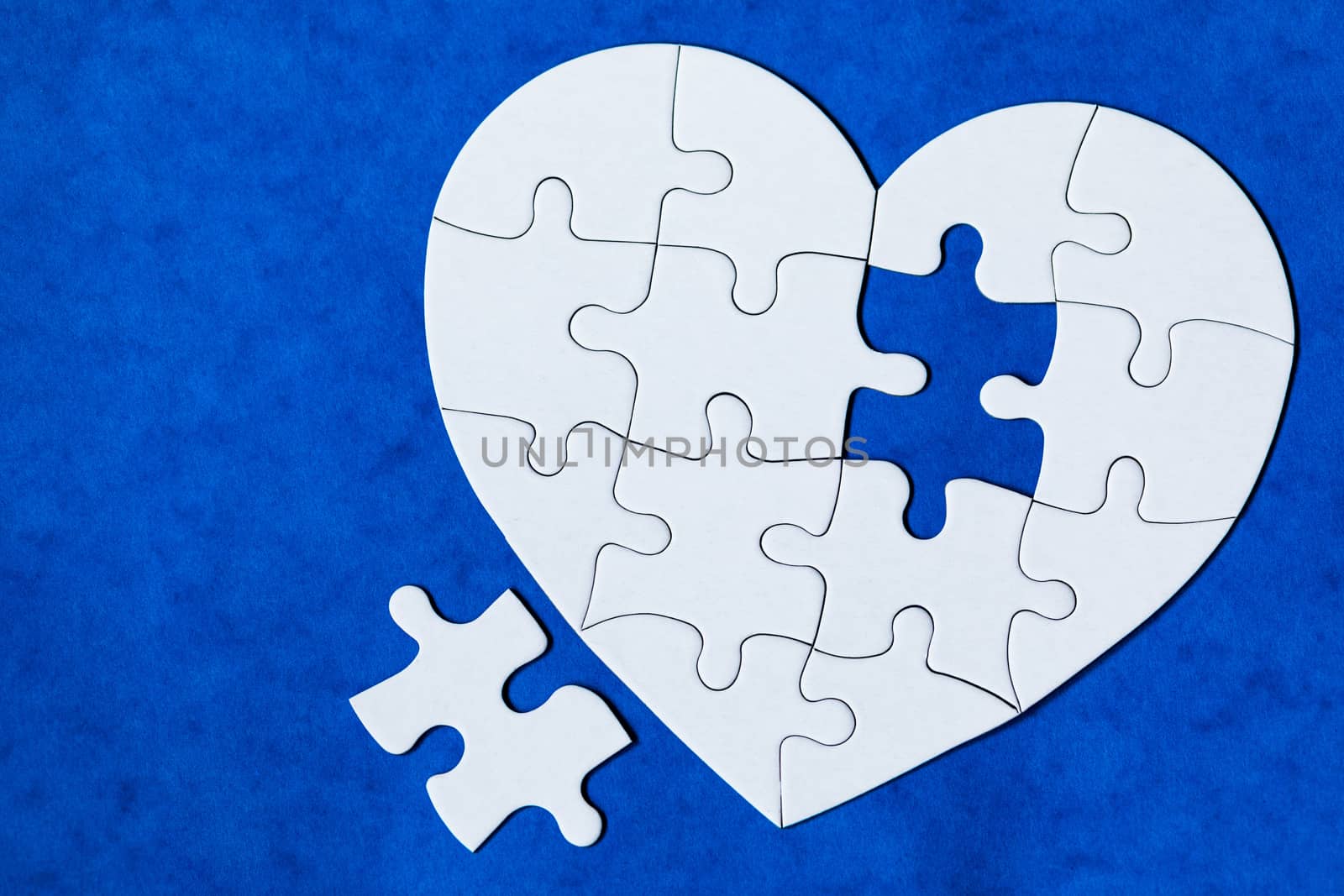 Heart object made of puzzle pieces. Make complete heart. Jigsaw puzzle pieces in form of heart. Happy Valentines Day, greeting card template. Heart jigsaw puzzle.