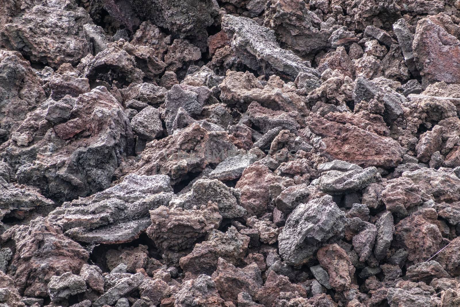 Leilani Estate, Hawaii, USA. - January 14, 2020: 2018 Kilauea volcano eruption hardened black lava field. Closeup of smaller rocks and pebbles on top.