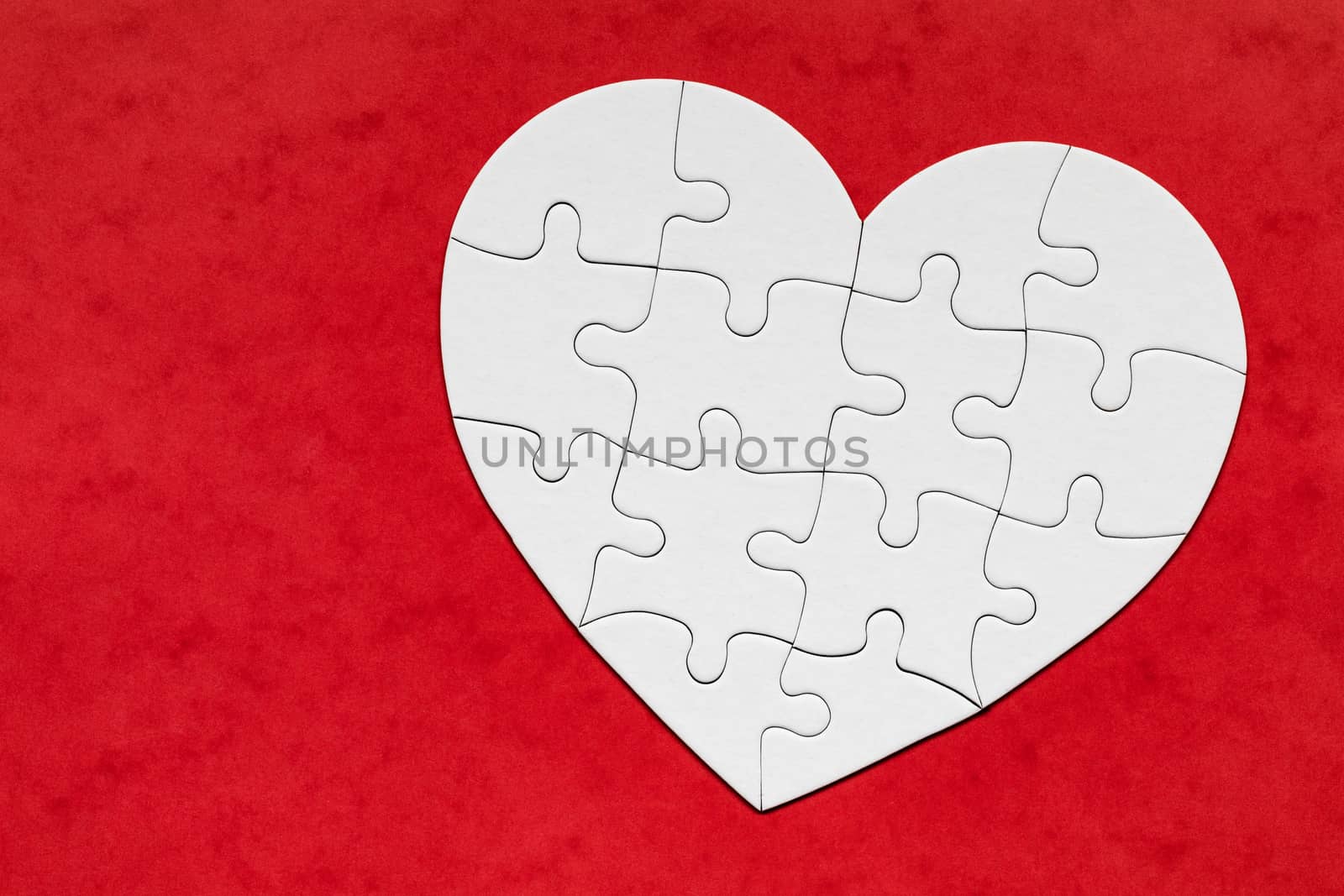 Heart object made of puzzle pieces. Make complete heart. Jigsaw puzzle pieces in form of heart. Happy Valentines Day, greeting card template. Heart jigsaw puzzle.