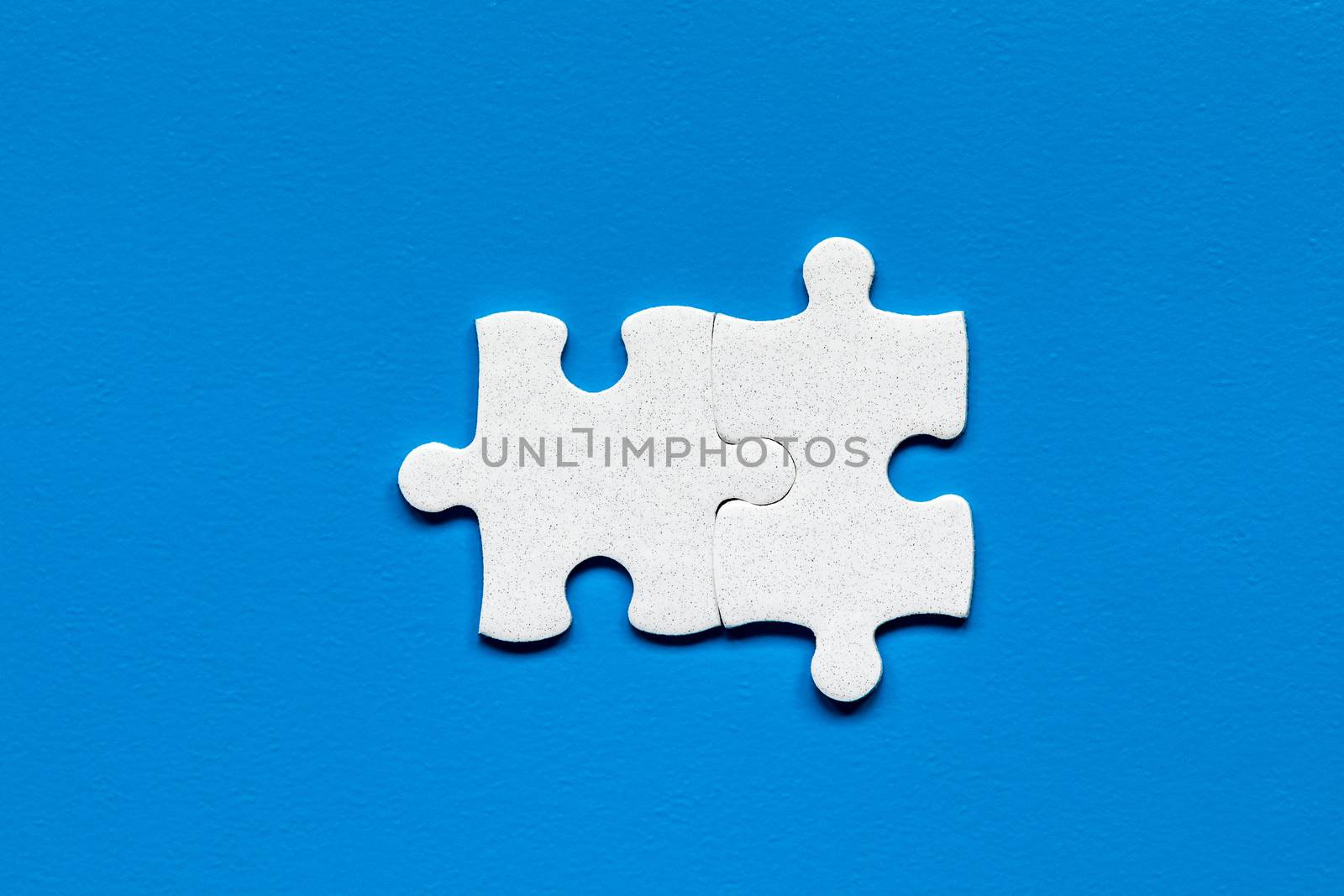 Closeup of jigsaw puzzle isolated. Missing jigsaw puzzle piece, business concept for completing the puzzle piece. Group of puzzle and a puzzle piece. Teamwork concept. Think difference concept. 