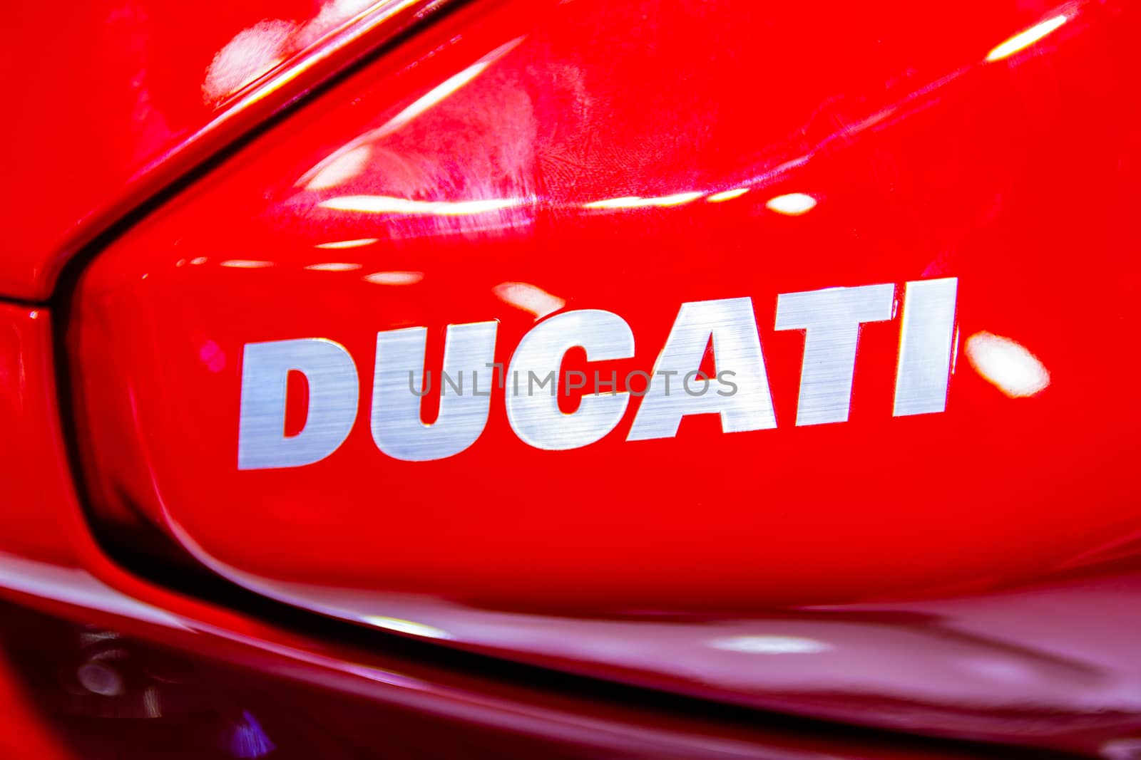 Nonthaburi Thailand:- December 8, 2017:  Closeup - Logo "DUCATI" Red Motorcycle Ducati Monster at International Motor Show 2017 - Nonthaburi, Thailand by piyaphun