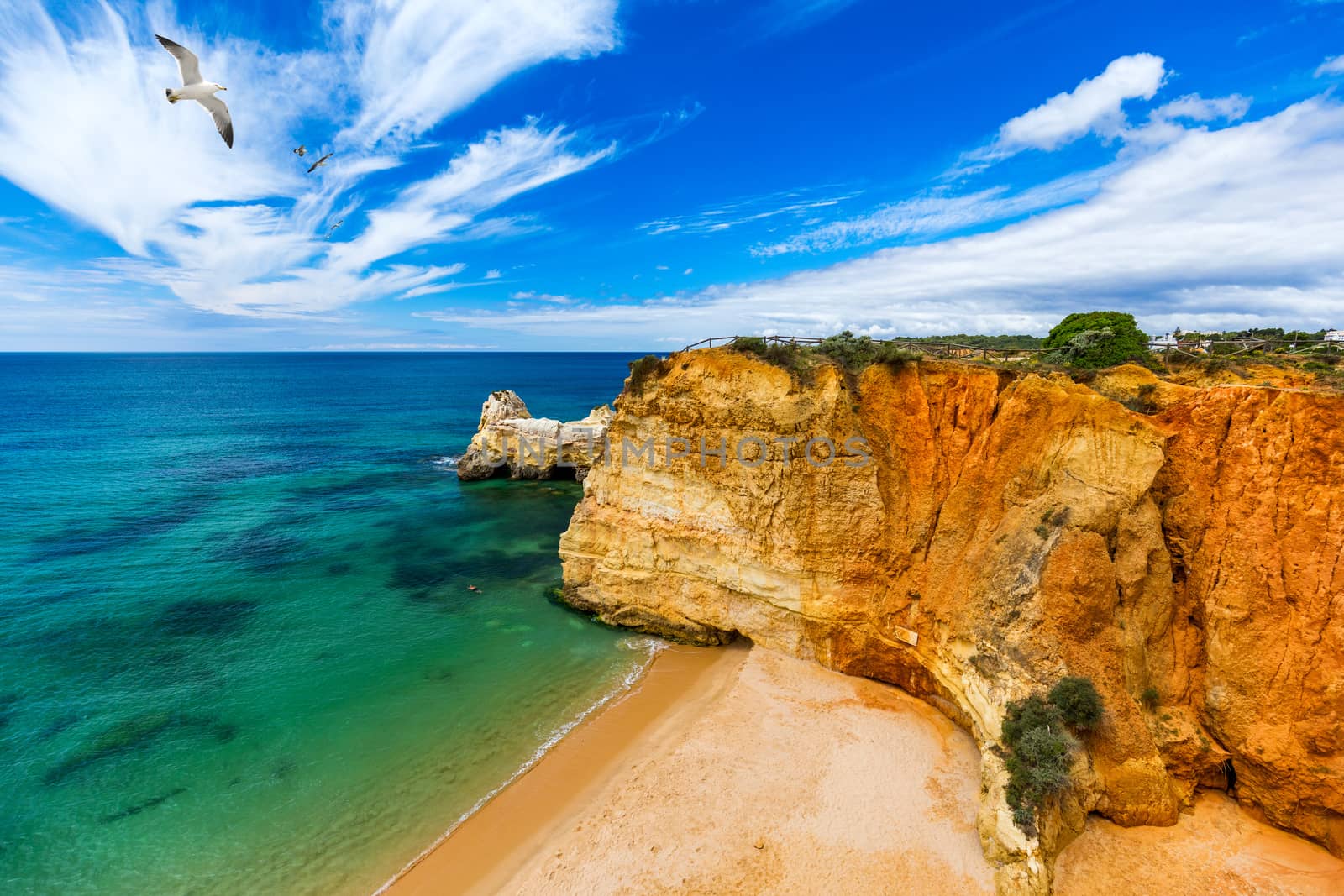 Praia dos Tres Castelos in south Portugal, Portimao, Algarve region. Landscape with Atlantic Ocean, shore and rocks in Tres Castelos beach (Praia dos Tres Castelos), Algarve, Portimao, Portugal.