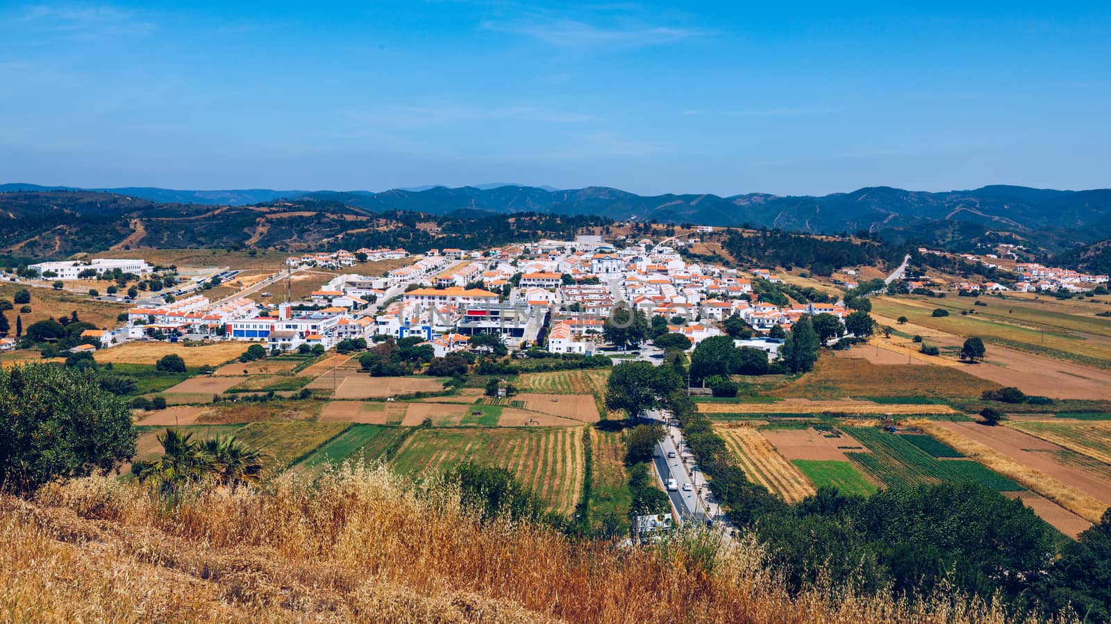 Charming architecture of hilly Aljezur, Algarve, Portugal. View to the small town of Aljezur with traditional portuguese houses and rural landscape, Algarve, Portugal.