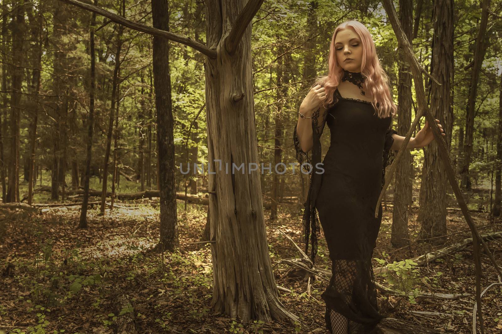 A Lovely Gothic Model Acts In A Forest Environment by actionsports