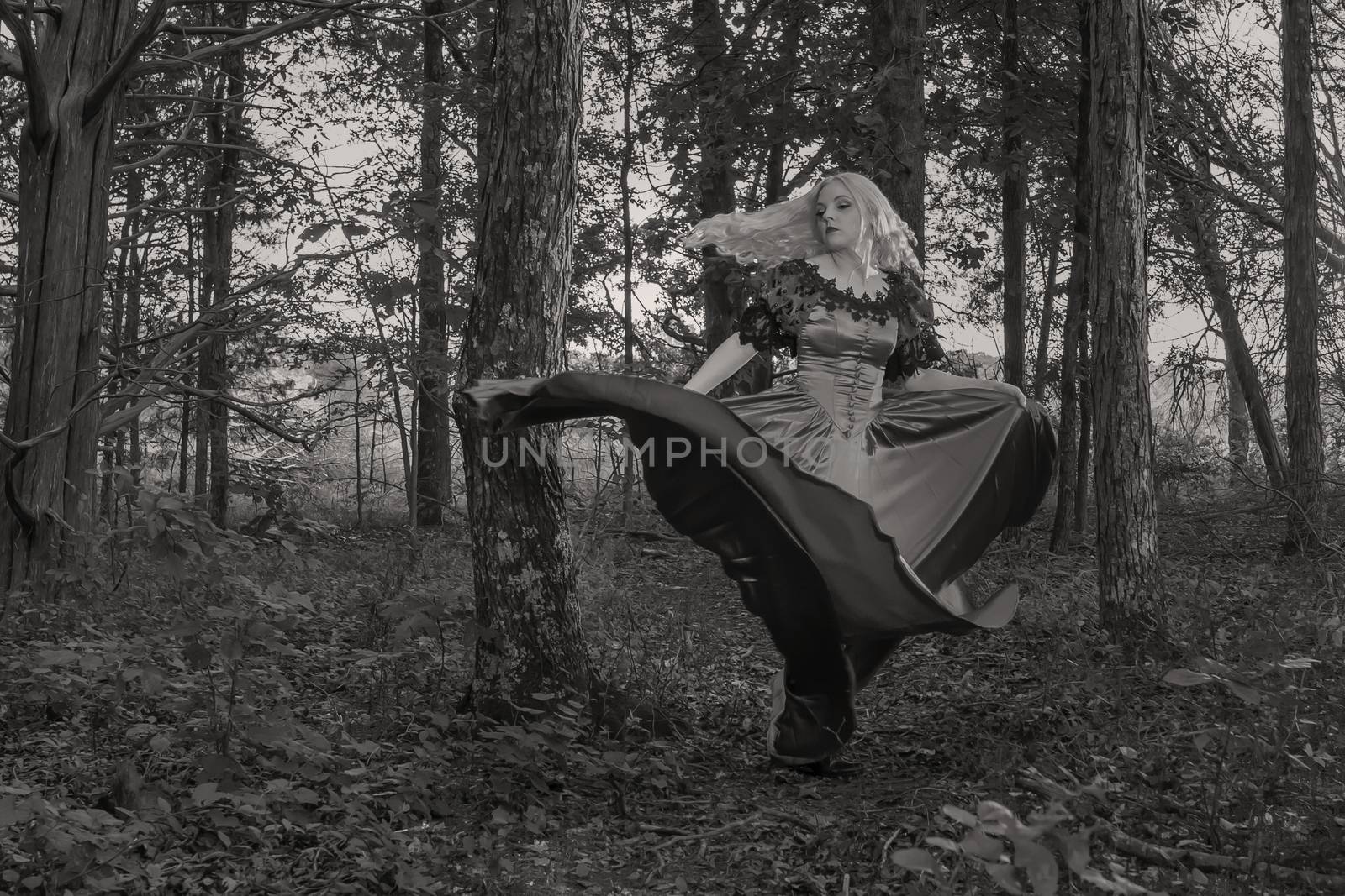 A gorgeous gothic model acts in a forest environment