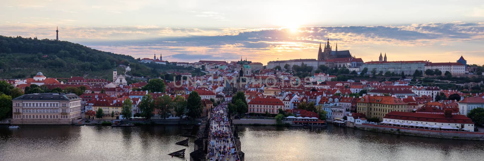 Scenic summer aerial panorama of the Old Town architecture in Prague, Czech Republic. Red roof tiles panorama of Prague old town.  Prague Old Town Square houses with traditional red roofs. Czechia.