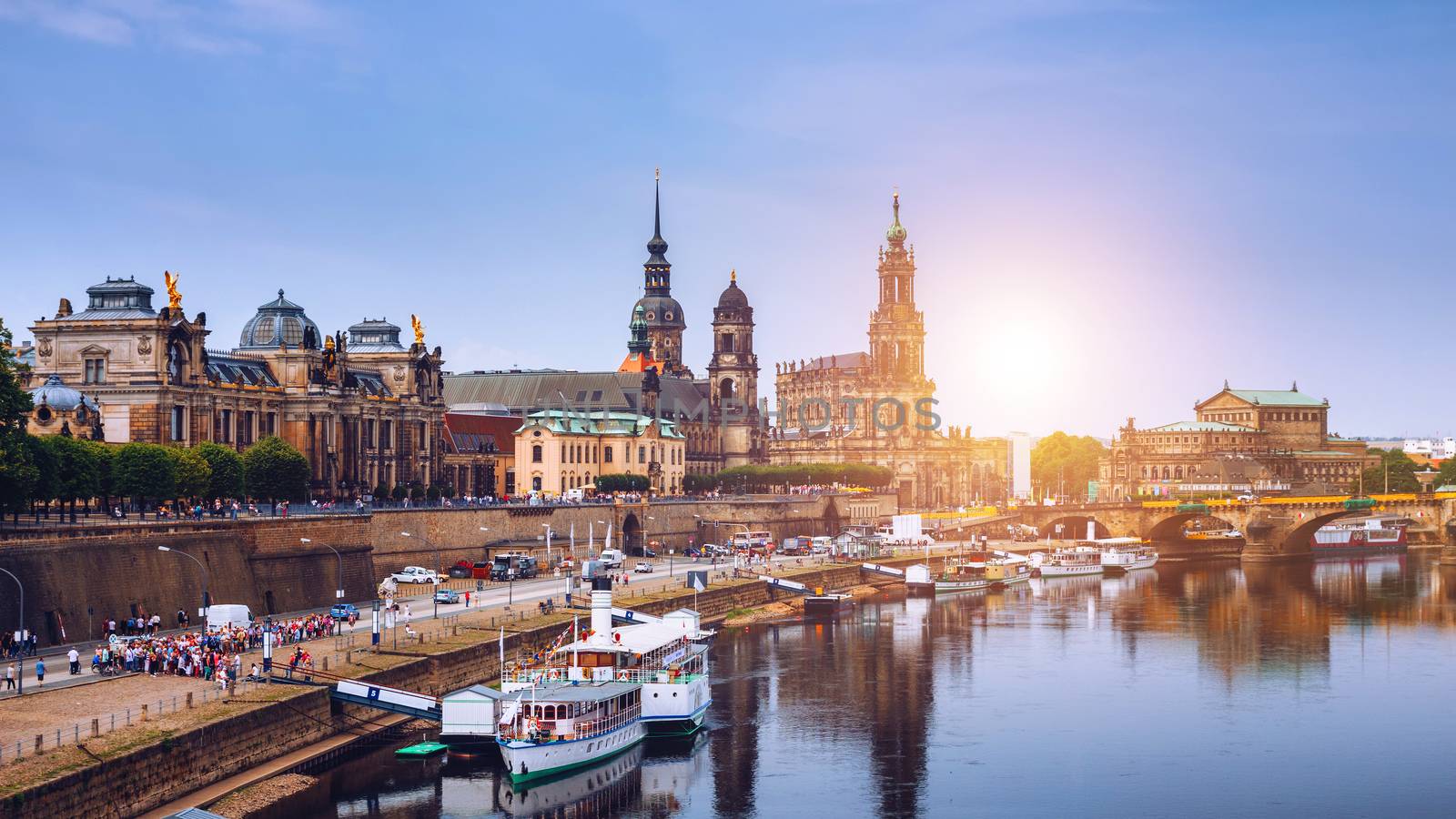 Incredible evening panorama of Cathedral of the Holy Trinity or Hofkirche, Bruehl's Terrace or The Balcony of Europe. Dramatic autumn sunset on Elbe river in Dresden, Saxony, Germany, Europe.