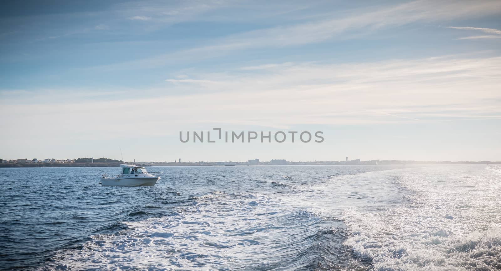fishing boat entering the harbor accompanied by seagulls by AtlanticEUROSTOXX