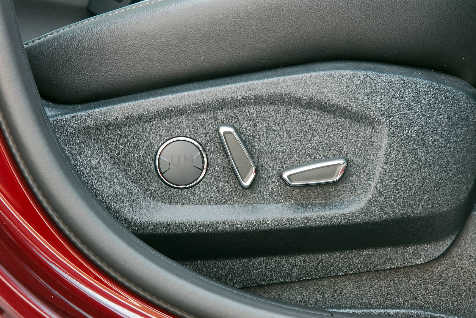 Buttons for adjusting seat position. Car interior detail