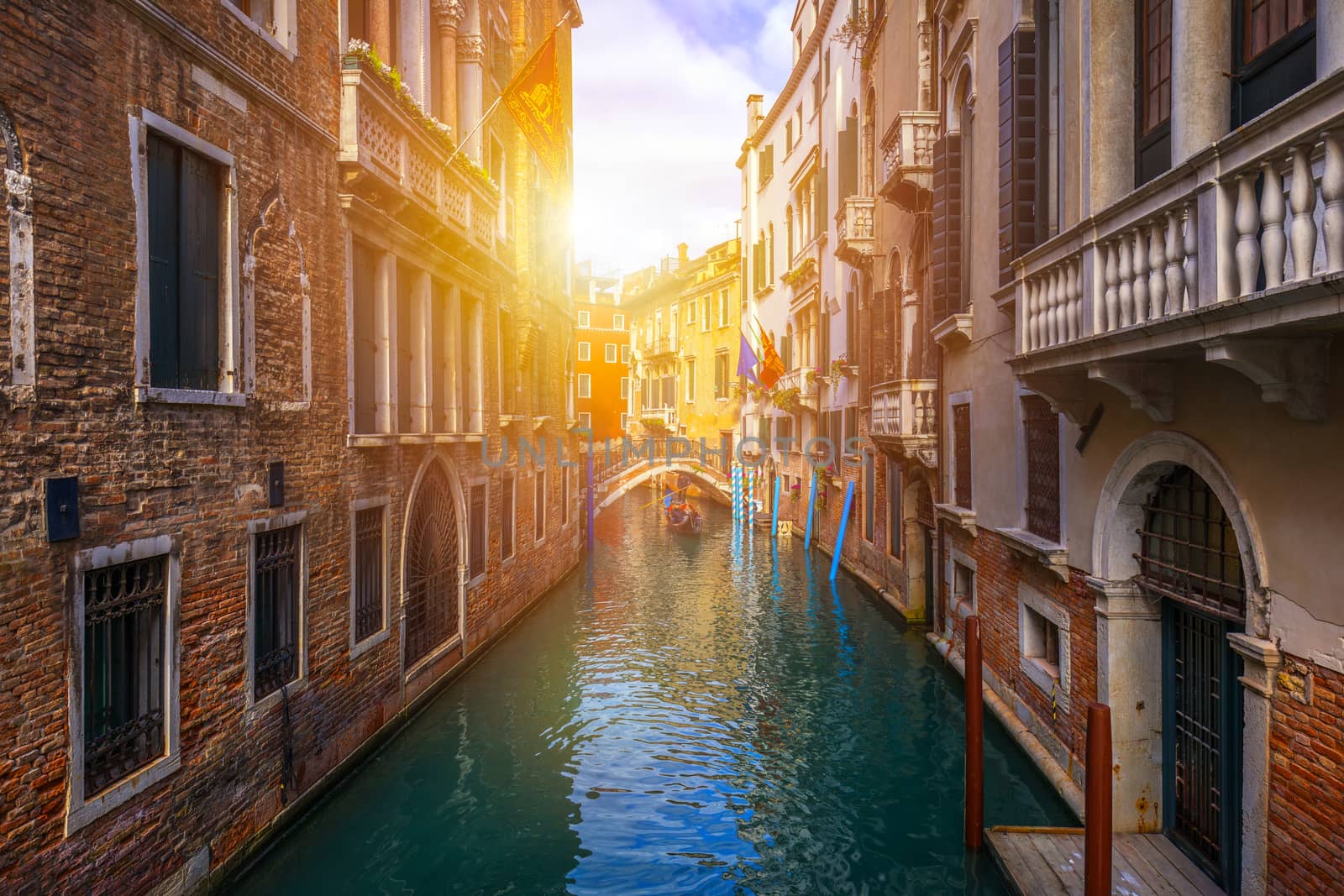 Canal with gondolas in Venice, Italy. Architecture and landmarks of Venice. Venice postcard with Venice gondolas.