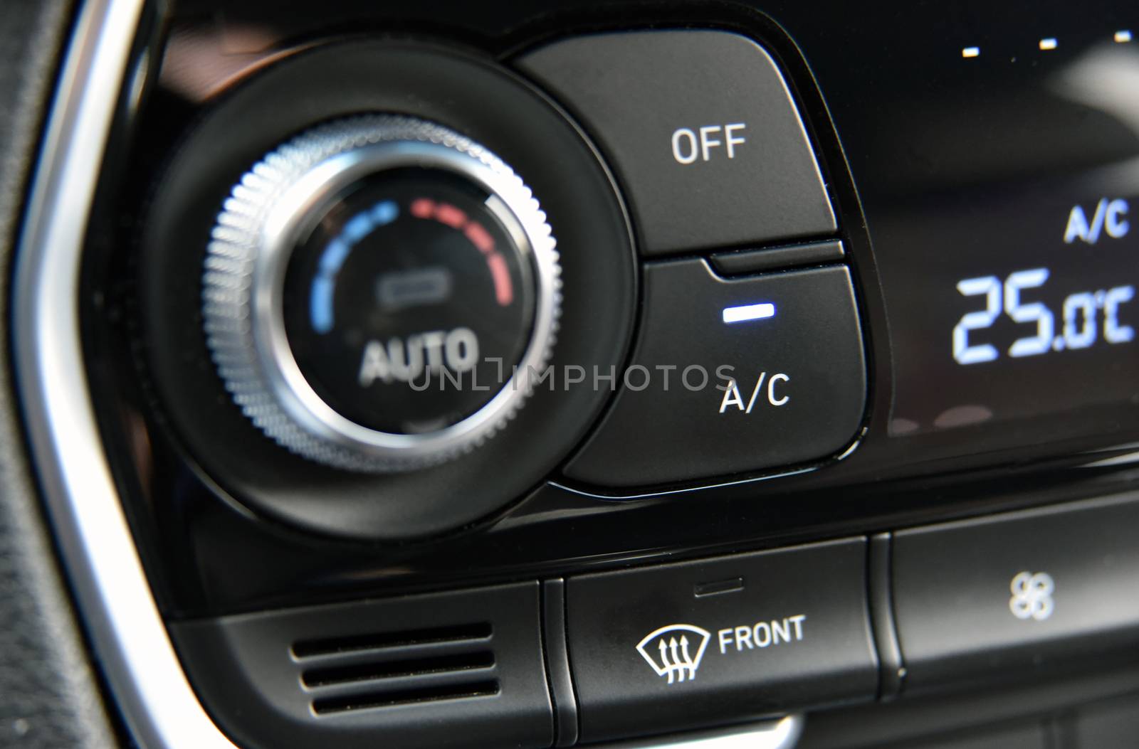 button for activating the air conditioners on the dashboard passenger car